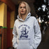 Featuring a playful illustration of a determined cat riding a scooter, this hoodie is the purr-fect way to announce your cat-loving intentions to the world.